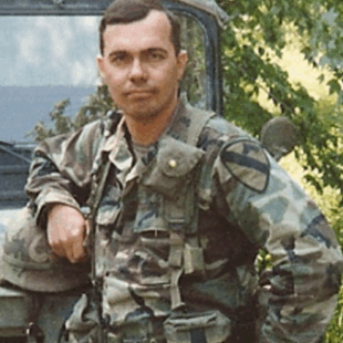 Portrait of H.W. Coyle, military veteran and bestselling author of Team Yankee and The Other Side of the Wire, known for military and historical fiction.
